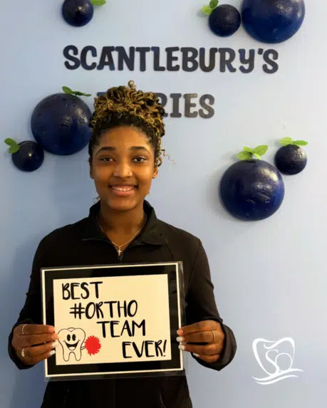 Patient smiling after Invisalign treatment at Scantlebury Orthodontics, NY