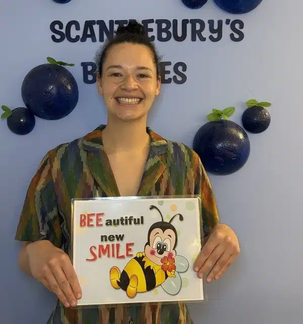 Patient smiling after Invisalign treatment near Crown Heights NY